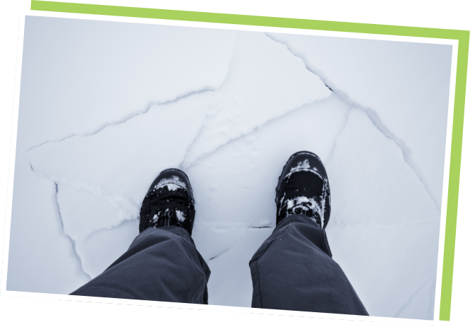 view of feet on cracking ice